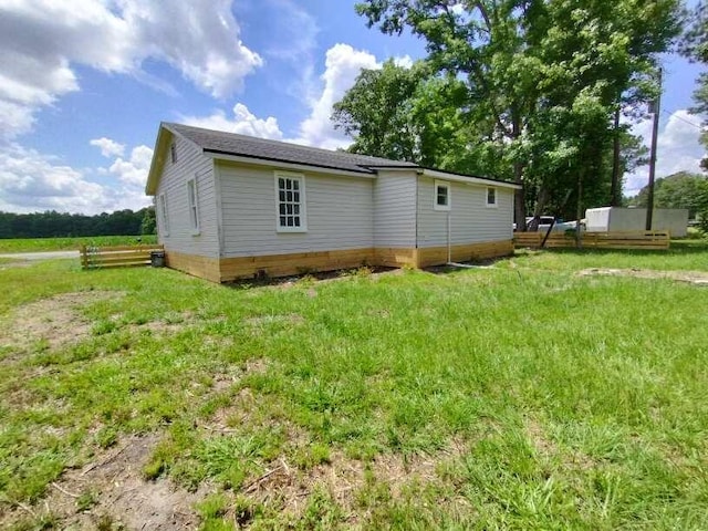 back of house with a yard