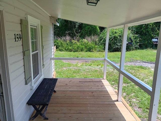 wooden deck with a yard and a porch