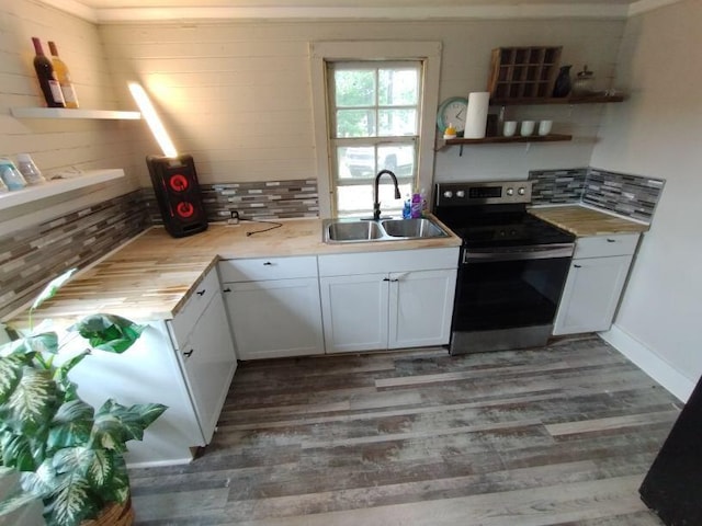 kitchen with backsplash, sink, electric stove, dark hardwood / wood-style floors, and white cabinetry