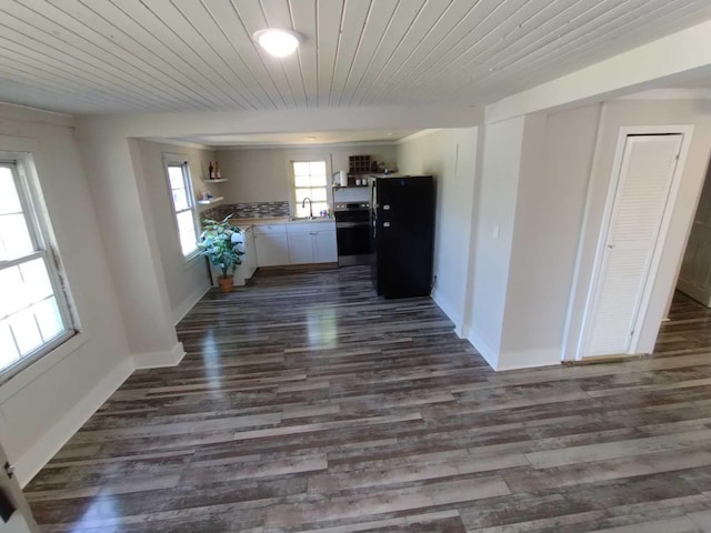 corridor featuring sink, dark hardwood / wood-style flooring, and wood ceiling