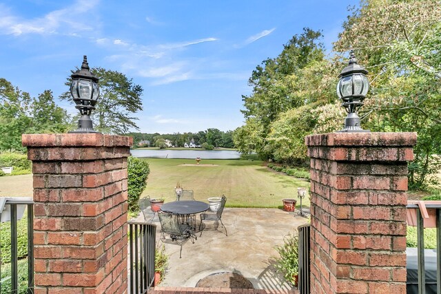 view of patio featuring a water view