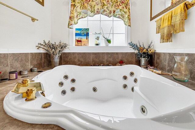 full bathroom featuring a whirlpool tub