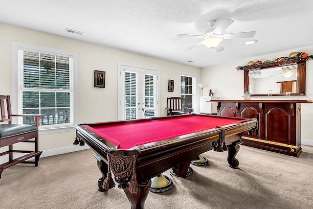 rec room with ceiling fan, bar, pool table, and a wealth of natural light