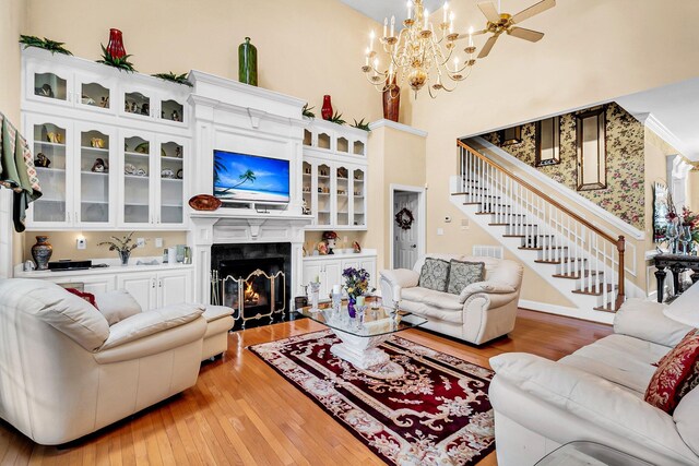 living room with wood-type flooring and ceiling fan