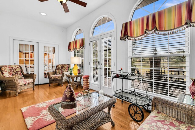 living area with hardwood / wood-style floors, ceiling fan, french doors, and recessed lighting