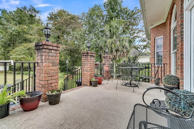 view of patio featuring outdoor dining area