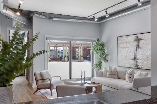 150 Bee St Unit 308, Charleston, SC 29401 - living room with rail lighting and wood finished floors