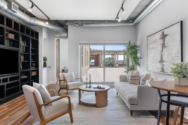 150 Bee St Unit 308, Charleston, SC 29401 - living room featuring track lighting and wood finished floors