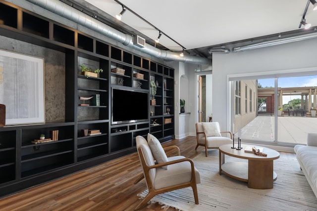 150 Bee St Unit 308, Charleston, SC 29401 - living room featuring rail lighting and wood finished floors