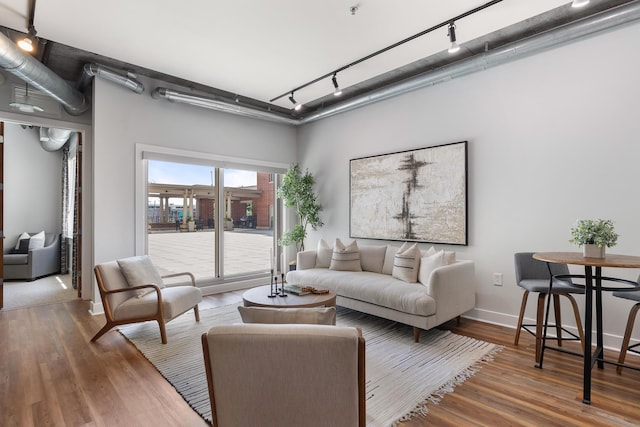 150 Bee St Unit 308, Charleston, SC 29401 - living room featuring track lighting and wood finished floors