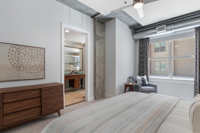 150 Bee St Unit 308, Charleston, SC 29401 - carpeted bedroom with ensuite bath and baseboards
