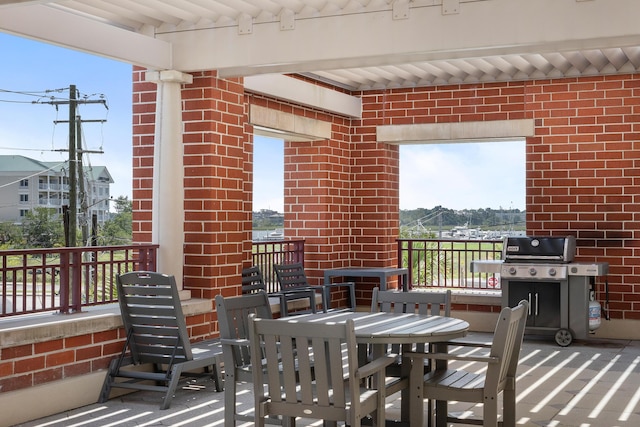 150 Bee St Unit 308, Charleston, SC 29401 - view of patio / terrace featuring a grill and outdoor dining space