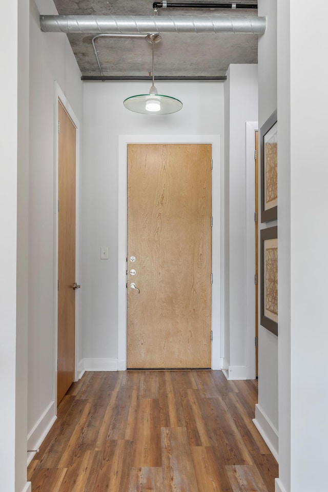 150 Bee St Unit 308, Charleston, SC 29401 - hallway featuring wood finished floors and baseboards