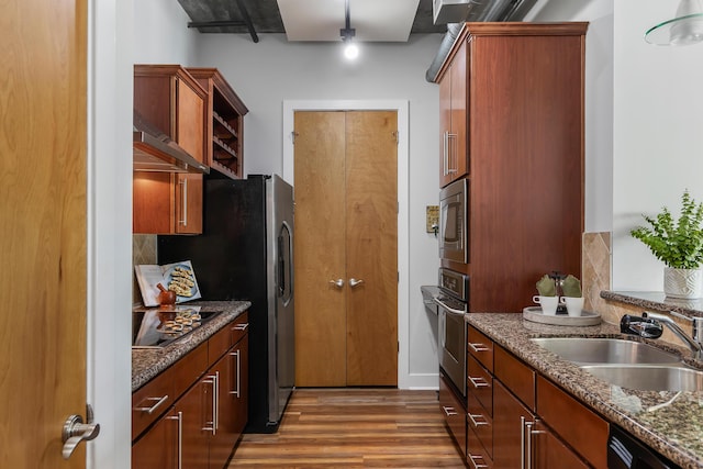 150 Bee St Unit 308, Charleston, SC 29401 - kitchen with black appliances, wood finished floors, range hood, dark stone counters, and open shelves