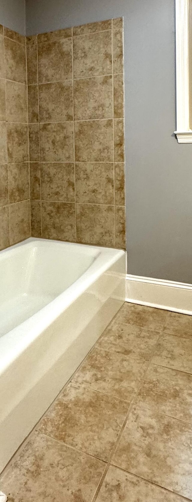bathroom with baseboards
