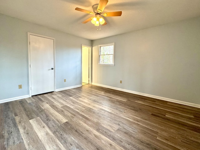 unfurnished bedroom featuring ceiling fan and wood-type flooring