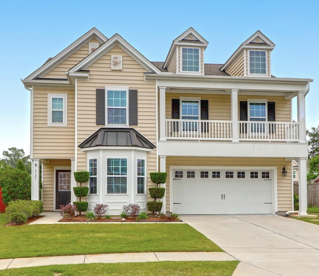 9785 Black Willow Ln, Ladson, SC 29456 - view of front of property featuring a garage, driveway, a front lawn, and a balcony