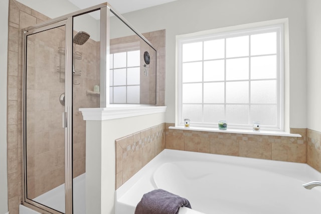 9785 Black Willow Ln, Ladson, SC 29456 - bathroom with healthy amount of natural light, a garden tub, and a stall shower