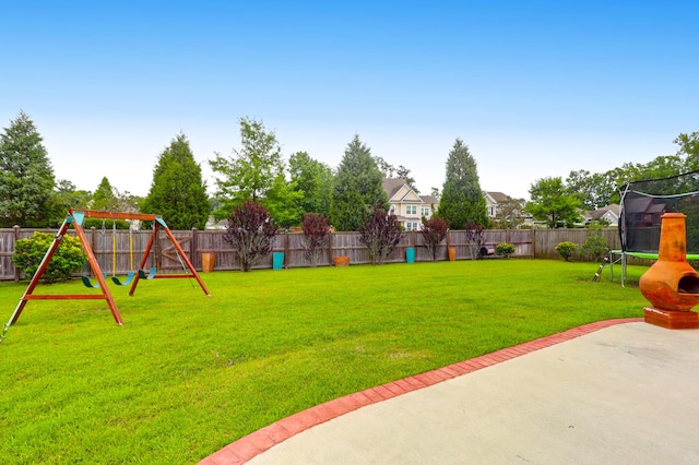 9785 Black Willow Ln, Ladson, SC 29456 - view of yard featuring a trampoline, a patio area, and a playground