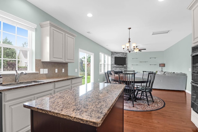9785 Black Willow Ln, Ladson, SC 29456 - kitchen featuring a sink, open floor plan, a chandelier, dark wood-style floors, and recessed lighting