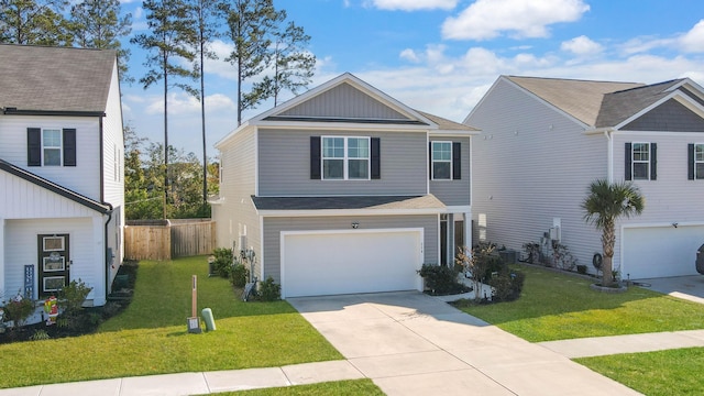 view of front of home featuring a front yard and a garage