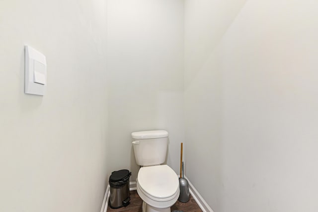 bathroom featuring hardwood / wood-style floors and toilet