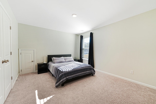 bedroom with light colored carpet