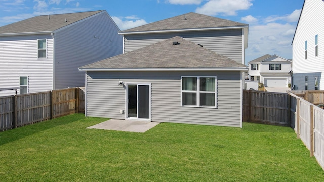 back of property featuring a patio area and a lawn