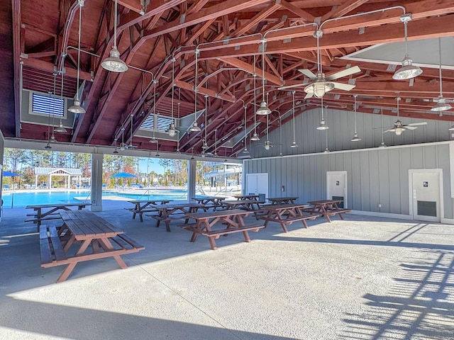 miscellaneous room with a pool, vaulted ceiling, a wealth of natural light, and ceiling fan