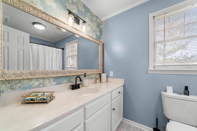 bathroom with toilet, a wealth of natural light, vanity, and ornamental molding