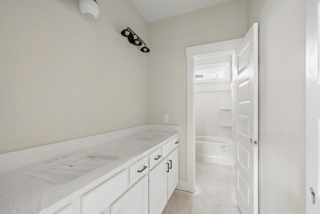 bathroom featuring tub / shower combination and vanity