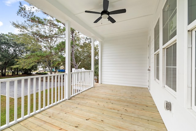 wooden deck featuring ceiling fan