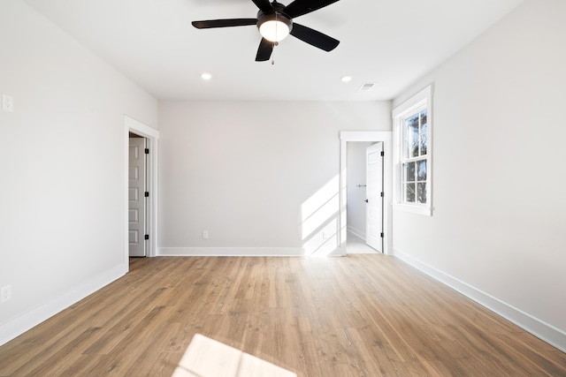 unfurnished room with ceiling fan and light hardwood / wood-style floors