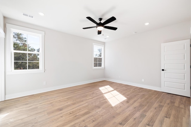 spare room featuring ceiling fan and light hardwood / wood-style floors