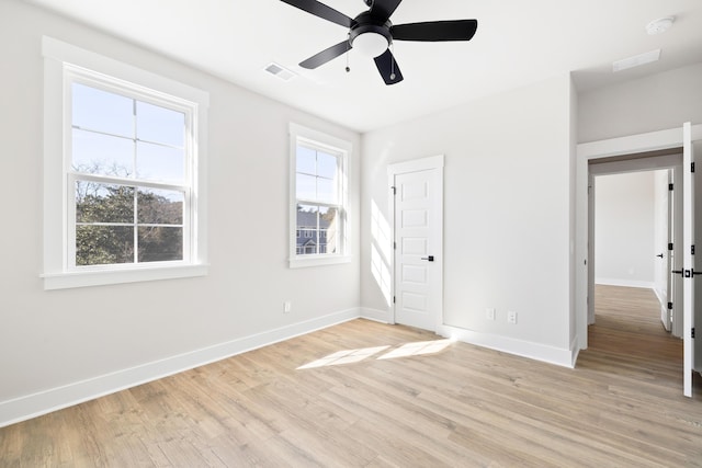 unfurnished bedroom with ceiling fan and light wood-type flooring