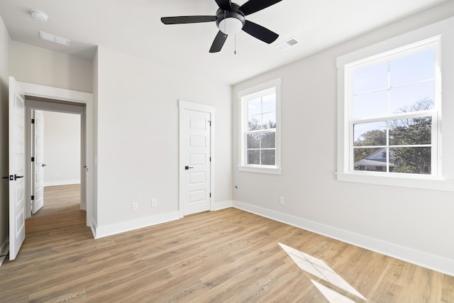 unfurnished bedroom with ceiling fan and wood-type flooring