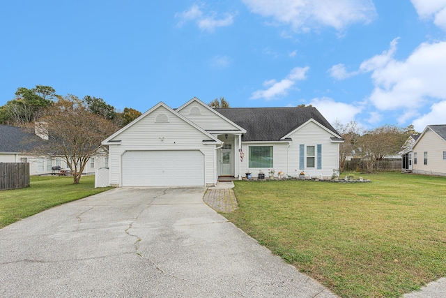 ranch-style house with driveway, an attached garage, fence, and a front lawn