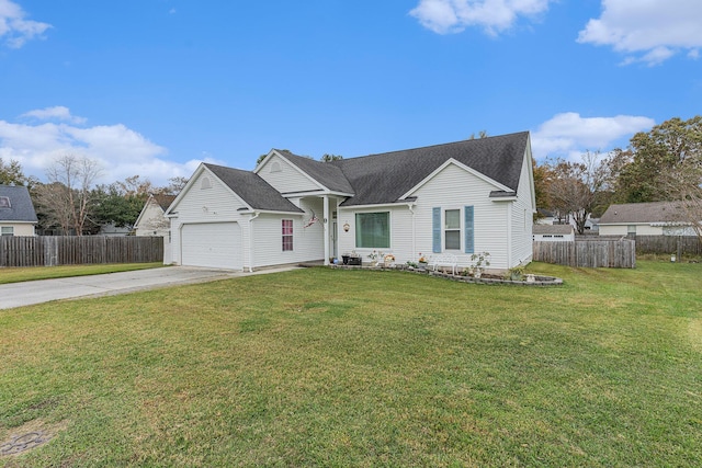 view of front of property featuring driveway, an attached garage, fence, and a front lawn