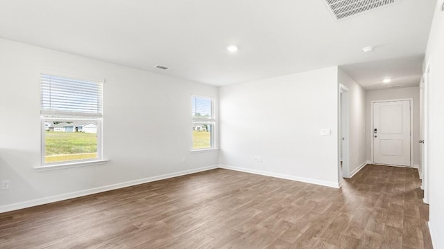 1009 Folly Rd, Summerton, SC 29148 - empty room featuring visible vents, baseboards, and wood finished floors