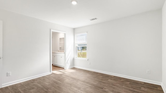1009 Folly Rd, Summerton, SC 29148 - empty room featuring visible vents, baseboards, and dark wood-style floors