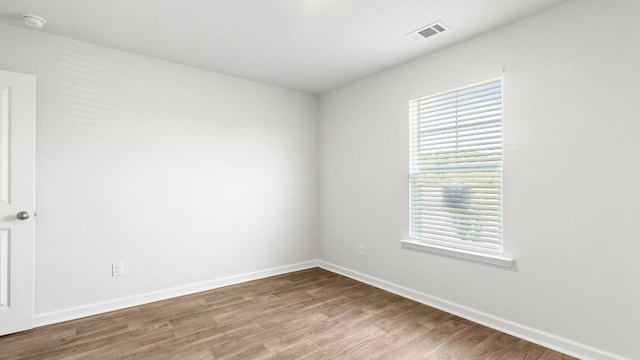 1009 Folly Rd, Summerton, SC 29148 - spare room featuring visible vents, baseboards, and wood finished floors