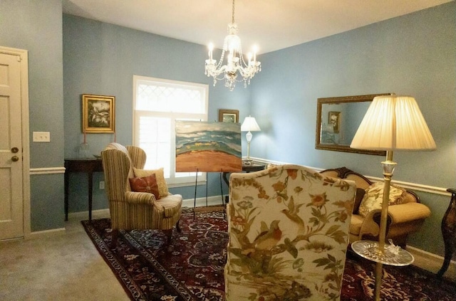 sitting room with a notable chandelier and carpet flooring