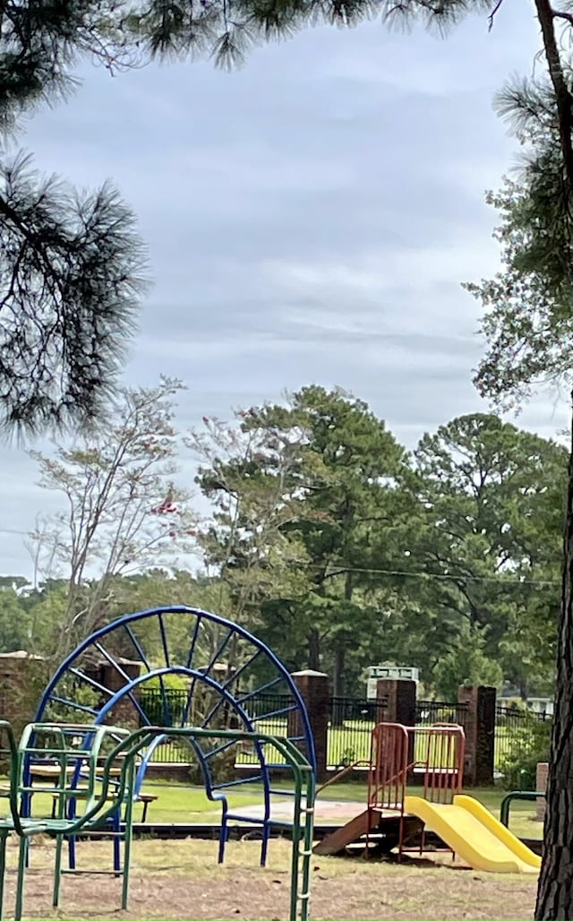 view of home's community featuring a playground