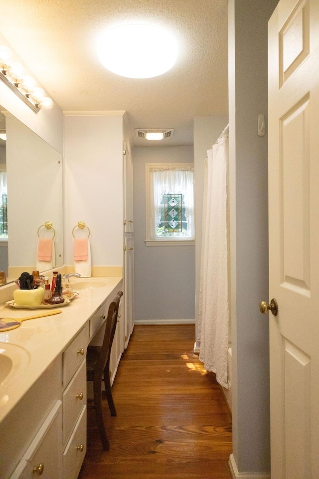 bathroom featuring vanity, hardwood / wood-style floors, and shower / tub combo