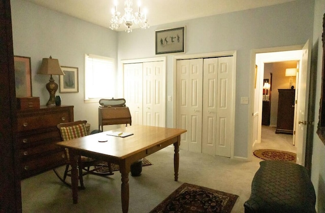 office area with light colored carpet and a chandelier