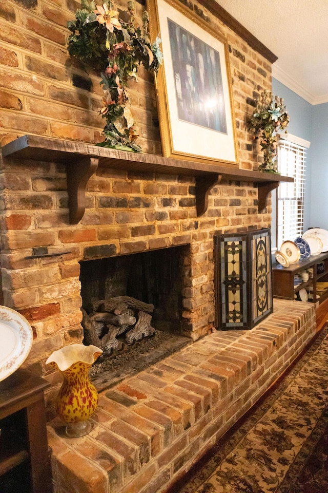 details with crown molding and a brick fireplace