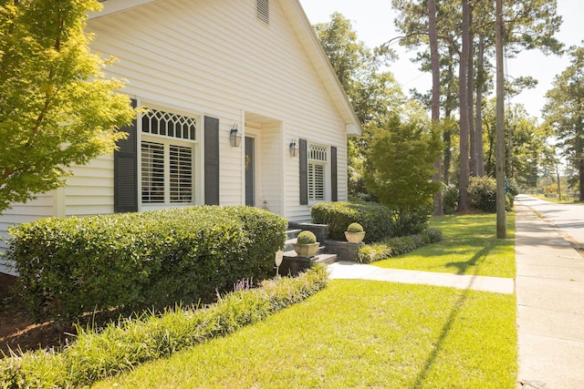 view of home's exterior featuring a yard