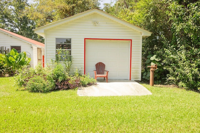 garage featuring a lawn