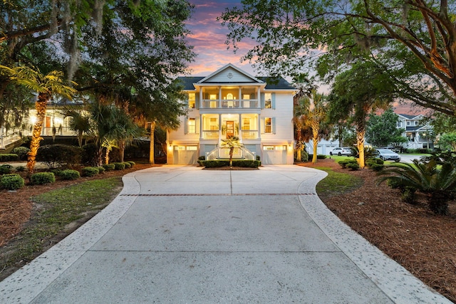 1635 Bull Creek Ln, Charleston, SC 29414 - coastal home with a balcony, driveway, and an attached garage