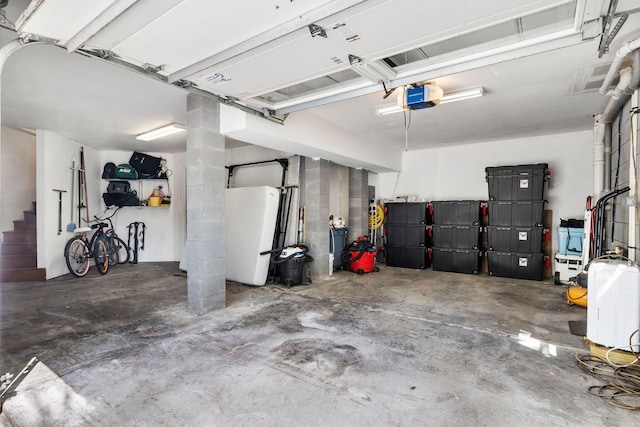 1635 Bull Creek Ln, Charleston, SC 29414 - garage with a garage door opener and freestanding refrigerator